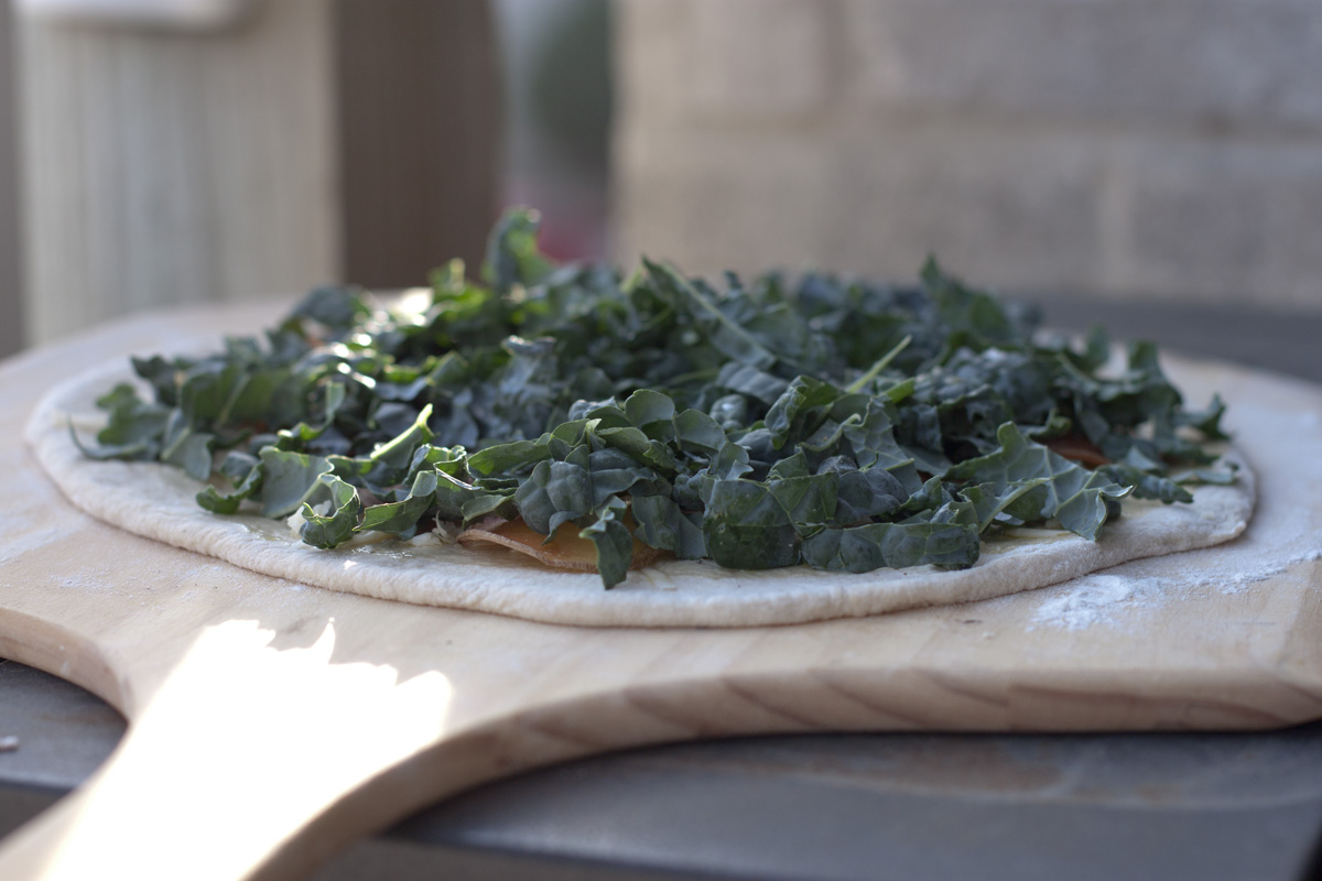 Kale and Potato Pizza ready to go onto the stone in the grill.